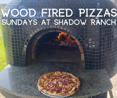 Shadow Ranch Pizza Oven with text saying Wood Fired Pizza - Sundays at Shadow Ranch